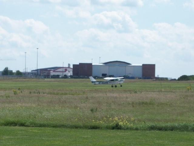 Quichen coming in for her solo landing on runway 22...: After her first solo circuit, Quichen Zhang comes in for successful landing.